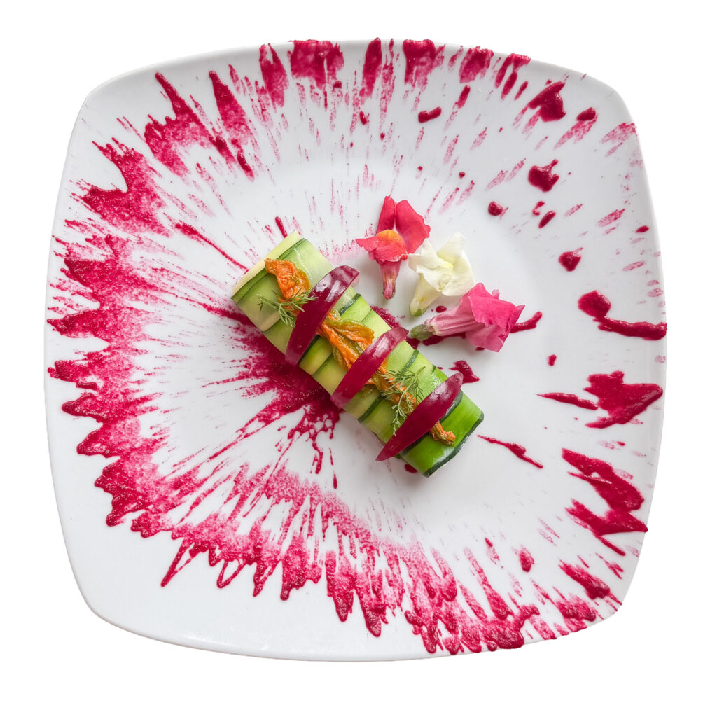 Zucchini roll filled with panzanella and spring onion