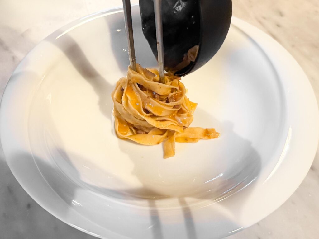 Plating our tagliatelle al ragù